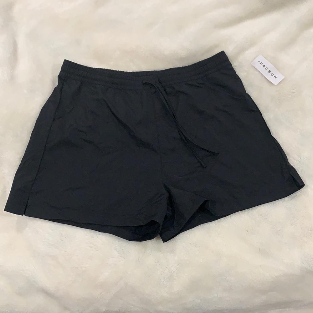 Black drawstring athletic shorts. High waist.
